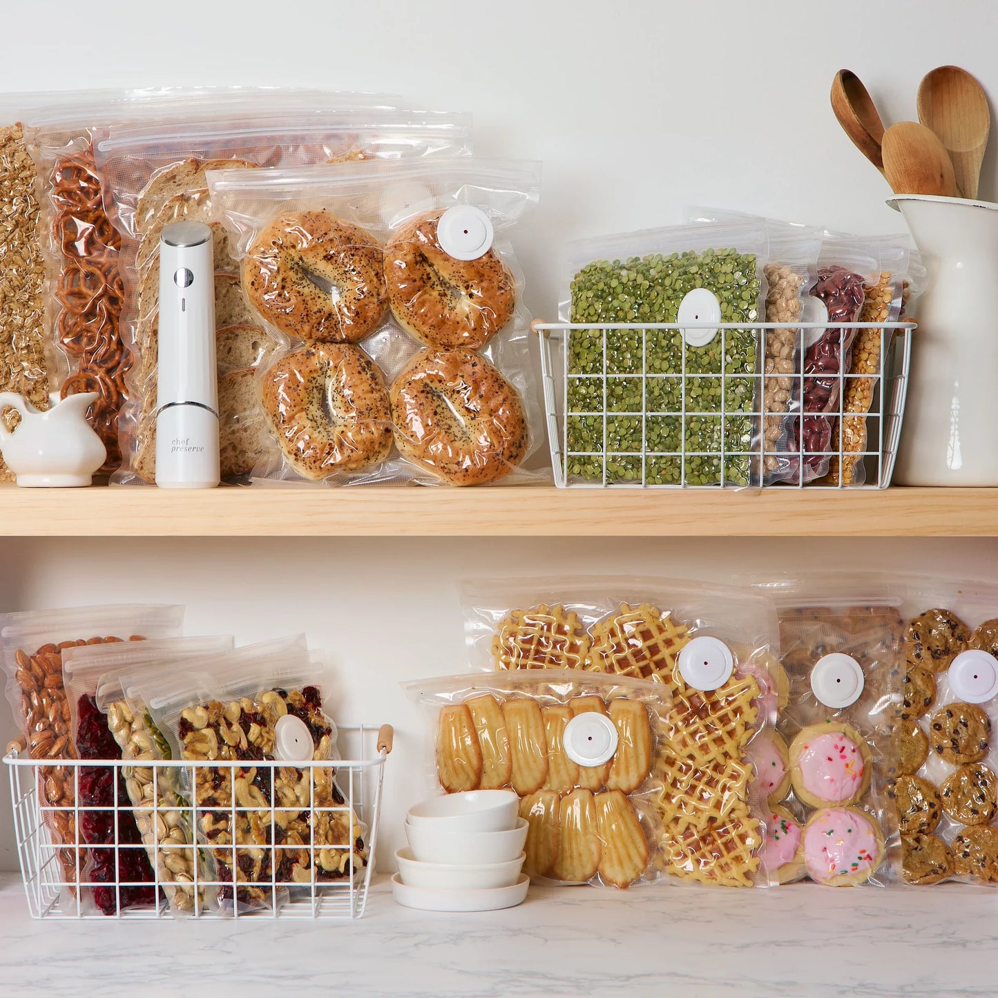 Snack items vacuum sealed and stored neatly using Chef Preserve compact vacuum sealer
